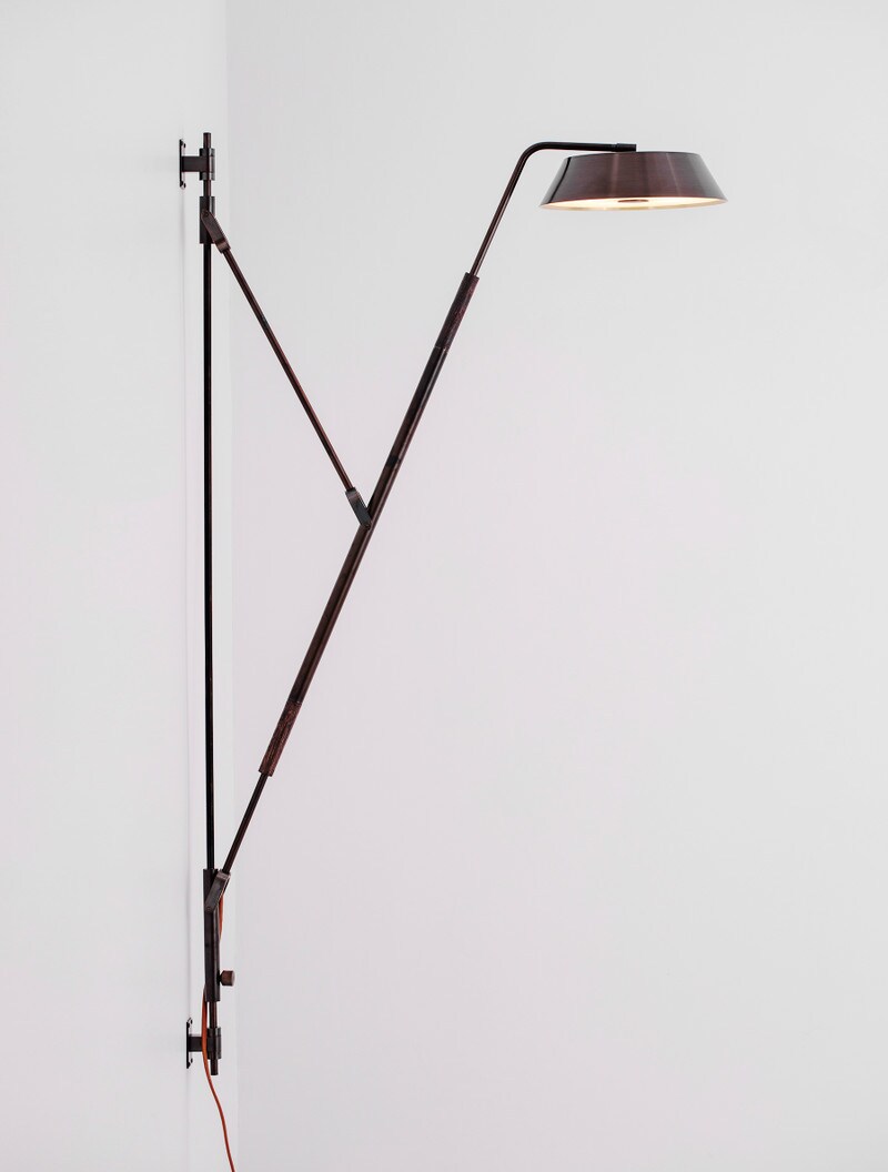 Crane Wall Lamp shown in Blackened Brass, and Black Walnut